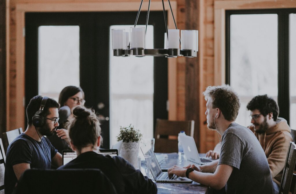 Group of professionals sitting at a table and working