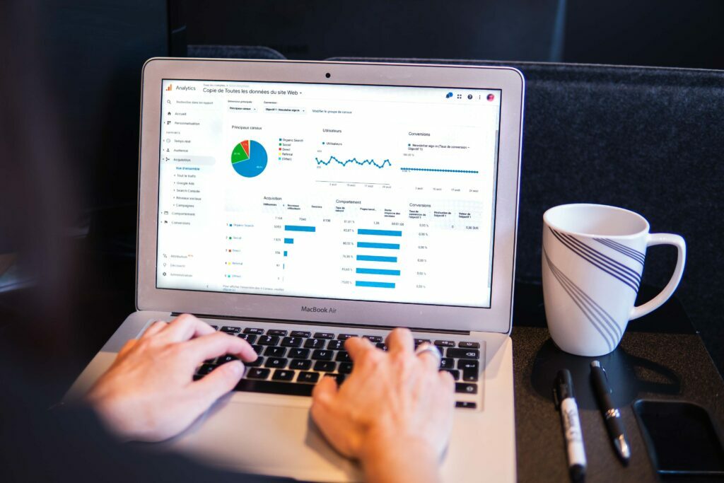 Person using Google Analytics on a MacBook Air 