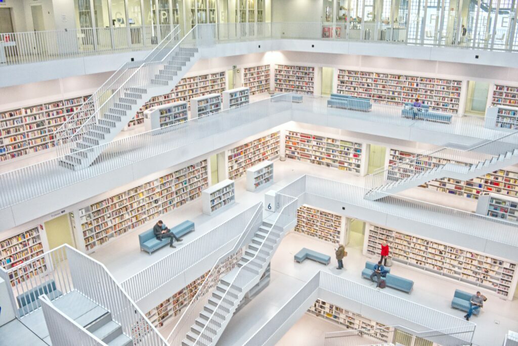 Enormous library with ladders and sofas