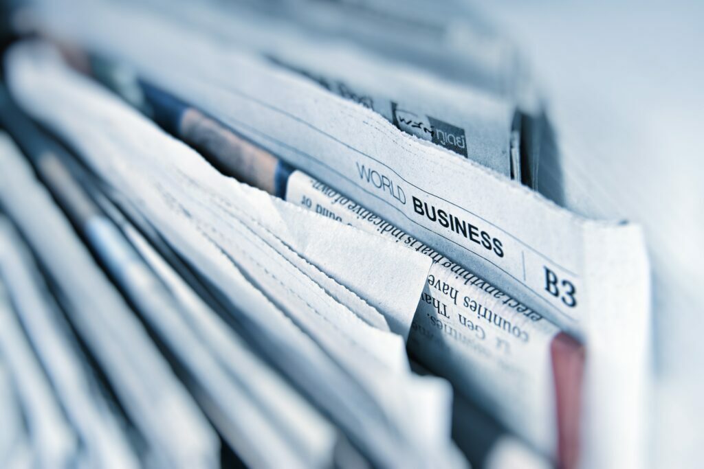 Newspapers stacked together