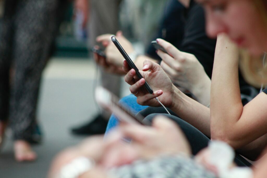 People on their mobile devices