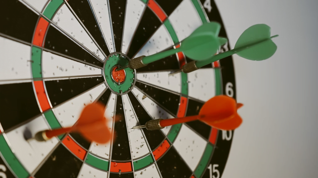 Dartboard with four darts on it