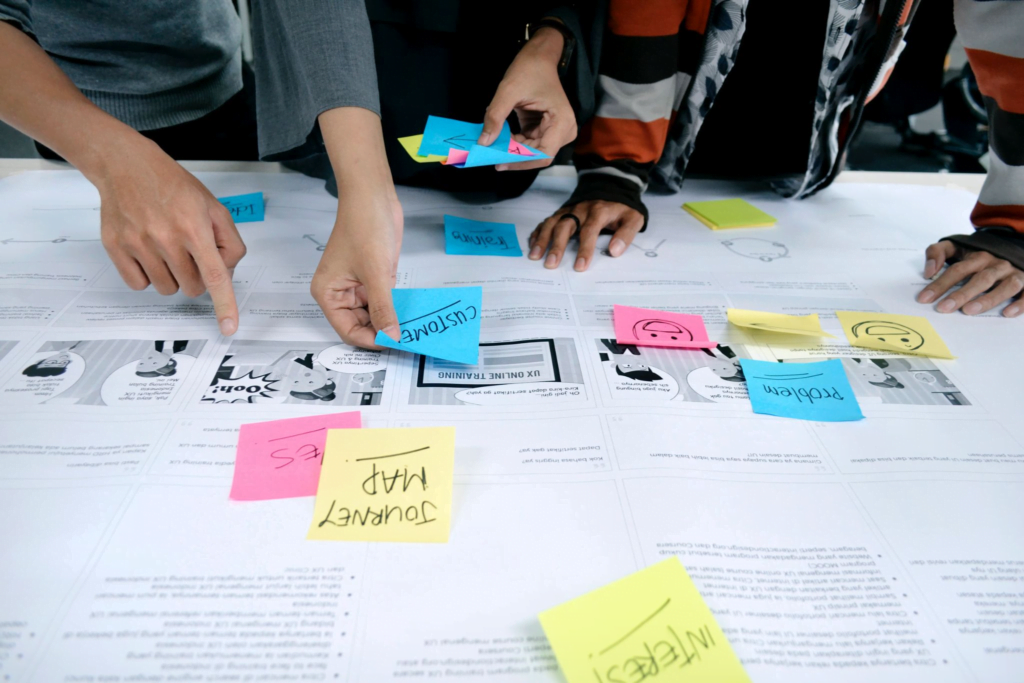 A group of coworkers working on a customer journey case study